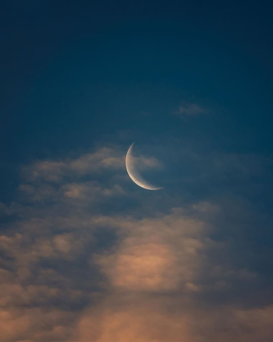 Night sky through clouds — a celestial wedding website mood